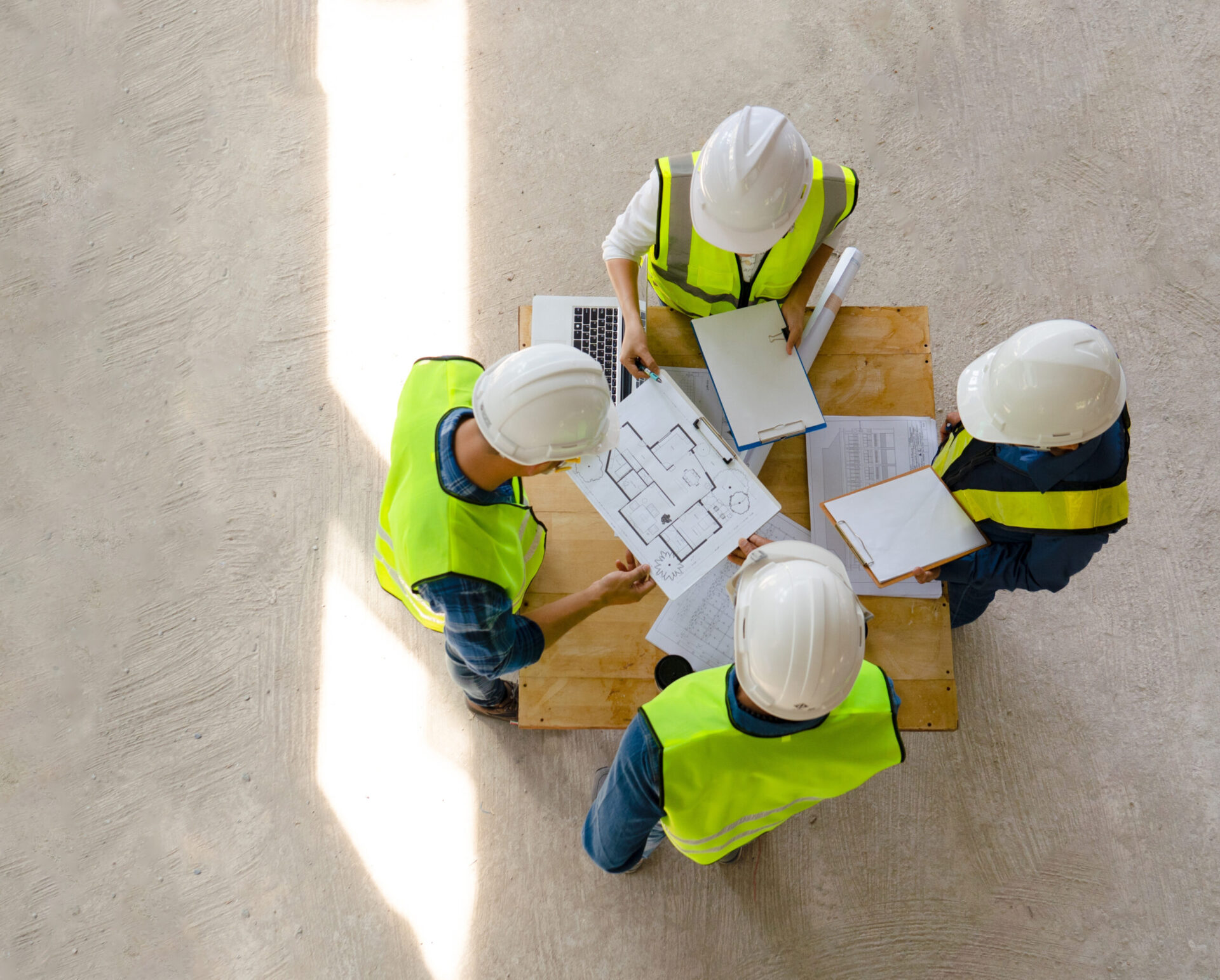 top view engineer discuss meeting together with architect foreman team while inspecting material of infrastructure construction progress for sustainable green building at site preparation copy space